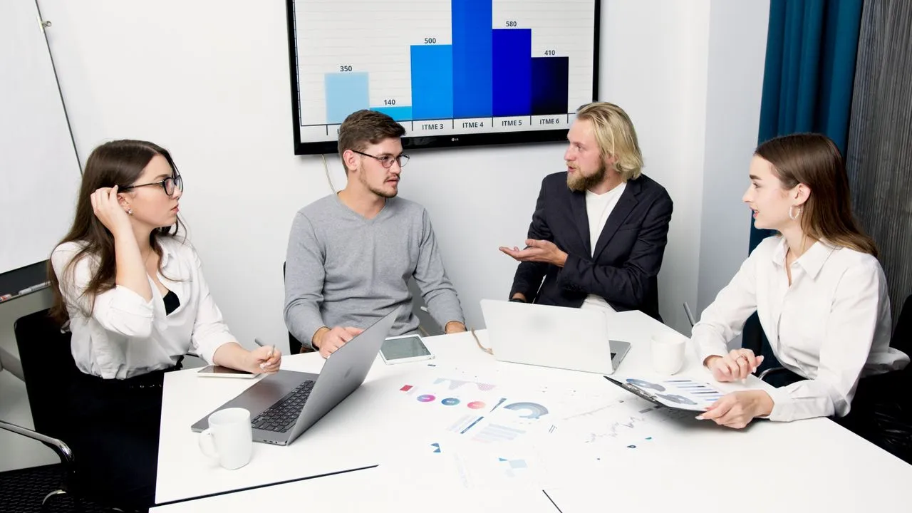 A group of people gathered to discuss the application of the ADKAR model in their company.